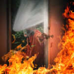Fireman in Fire Fighting and Evacuation Fire Drill Simulation Training For Safety in Condominium or Factory